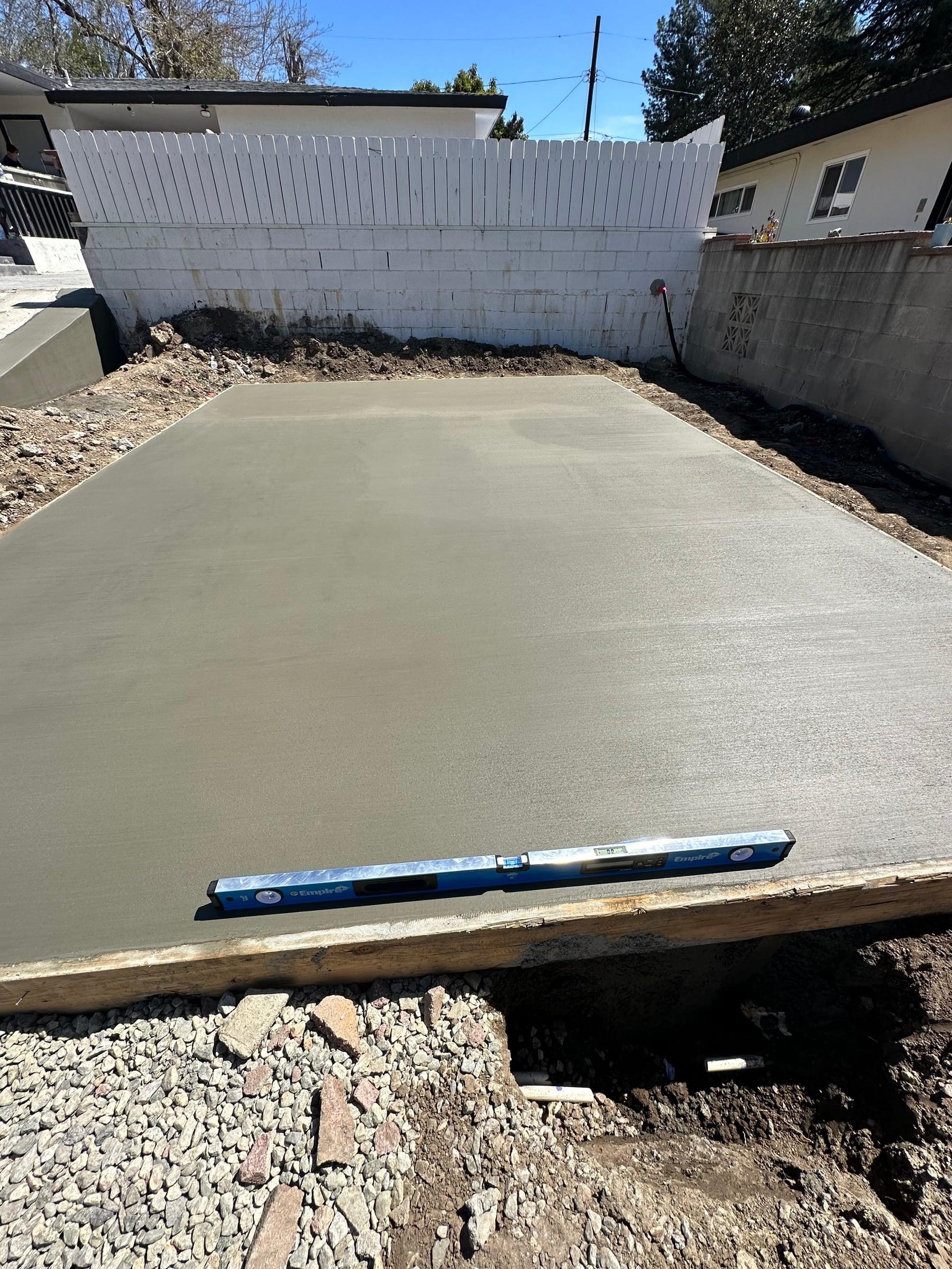 Stamped and decoratively finished concrete surface with a custom pattern