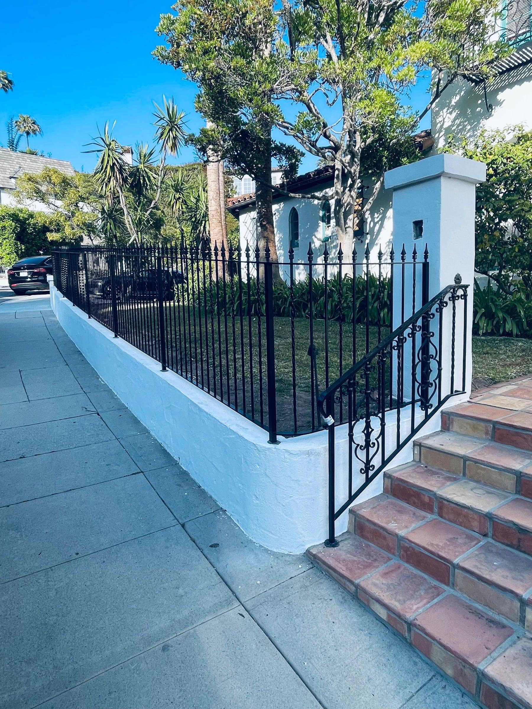 Custom iron gate installed at a driveway entrance