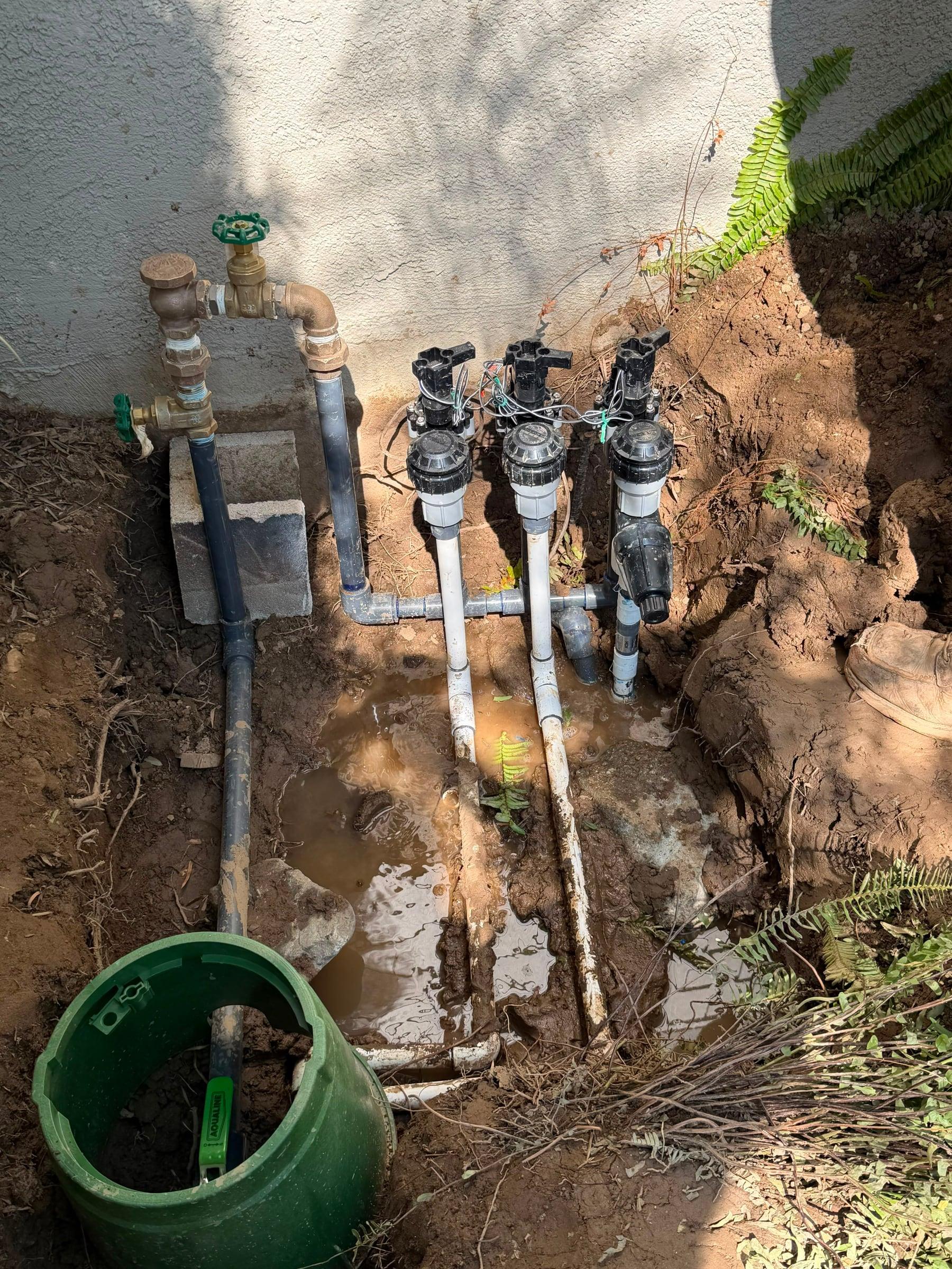 Valve manifold with anti-siphon valves and gate valve in a trench