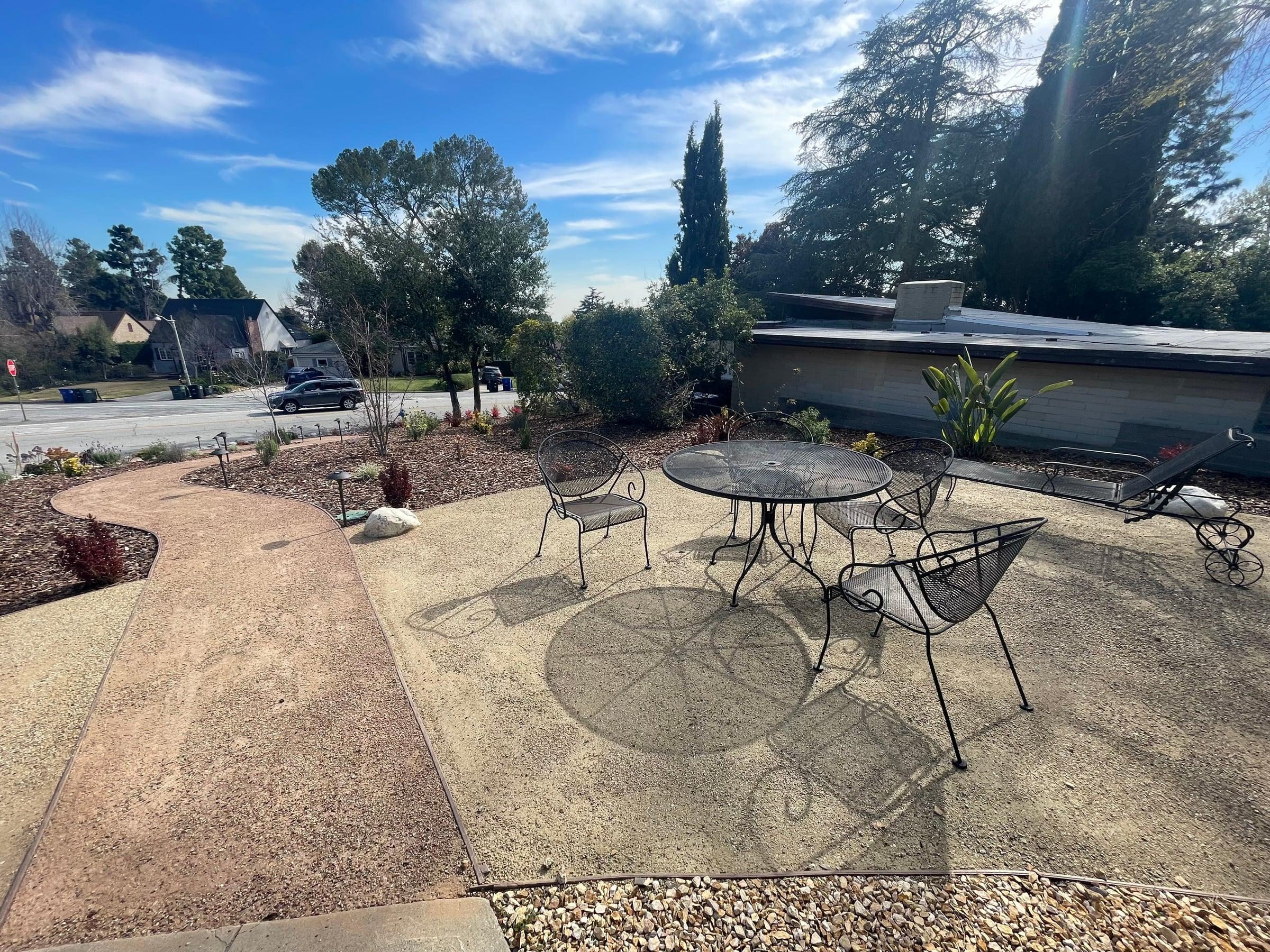 Front yard planting bed with mulch and new drought-tolerant plants